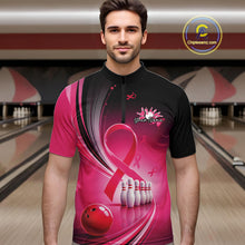 Load image into Gallery viewer, Male model wearing a black and pink bowling quarter zip with breast cancer awareness ribbon artwork and bowling graphics at the bowling lane