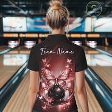 Load image into Gallery viewer, Back view of a female model in a bowling alley wearing a red polo shirt showcasing luminous butterflies and bowling-themed graphics.