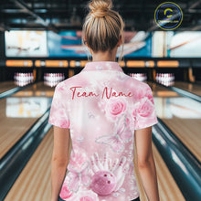 Load image into Gallery viewer, Back view of a female model in a bowling venue wearing a bowling polo shirt showcasing glitter butterflies, roses, bowling pins, and bowling graphics.