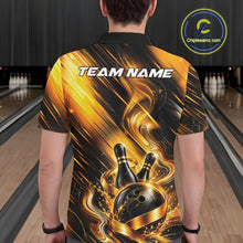 Load image into Gallery viewer, Back view of a male model wearing a bowling polo shirt featuring a black and gold bowling ball striking pins graphic with flowing metallic ribbon accents in a bowling lane.