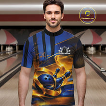 Load image into Gallery viewer, Front view of a male model wearing a bowling quarter zip shirt featuring a glossy blue bowling ball striking pins with elegant flowing gold ribbon accents in a bowling lane.