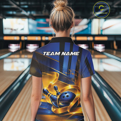 Back view of a female model wearing a bowling quarter zip shirt with a glossy blue bowling ball and pins illustration wrapped in flowing gold ribbons at a bowling lane.