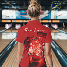 Load image into Gallery viewer, Back view of a women s red bowling polo shirt displaying butterfly artwork and bowling graphics inside a bowling center.