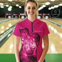 Load image into Gallery viewer, Female model in a pink bowling quarter zip featuring butterfly graphics and bowling artwork, front view inside a bowling alley