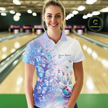 Load image into Gallery viewer, Front view of a female model wearing a bowling polo with pastel purple and pink holographic butterflies and vibrant bowling-themed graphics