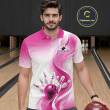 Load image into Gallery viewer, Male model wearing a white and pink bowling polo shirt with flowing abstract wave graphics and a glossy bowling ball striking pins at the bowling lane, front view