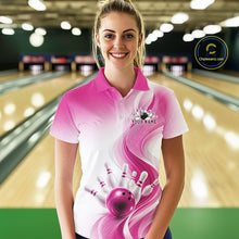 Load image into Gallery viewer, Front view of a female model wearing a white and pink bowling polo with flowing abstract wave accents and a glossy bowling ball striking pins
