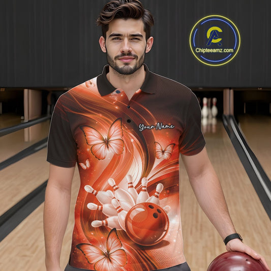Male model wearing an orange bowling polo in a bowling center with bowling strike graphics and butterfly accents.