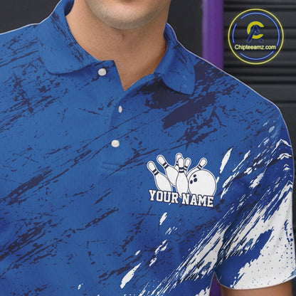 Close up of the left chest area on a white and blue bowling polo shirt featuring a splatter inspired athletic jersey pattern