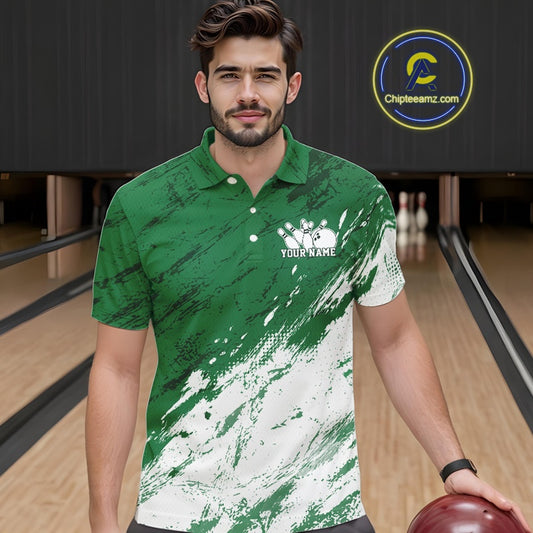 Front view of a male bowler wearing a white and green bowling polo shirt with a splatter-inspired sports jersey pattern in a bowling lane