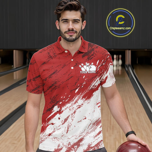 Man wearing a red and white polo shirt with a logo on a bowling alley.