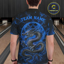 Load image into Gallery viewer, Back view of a male model in a bowling alley wearing a blue custom bowling polo shirt featuring an ancient dragon, flames, and a moon-inspired bowling ball design.