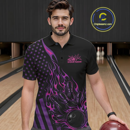 Male model at a bowling lane wearing a black bowling polo shirt with pink and purple flame bowling artwork and patriotic graphics.