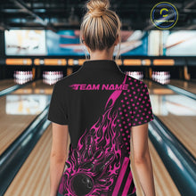 Load image into Gallery viewer, Back view of a female model in a bowling alley wearing a black polo shirt showcasing a pink flaming bowling ball hitting the pins.