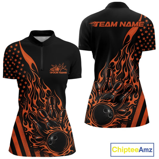 Front and back view of a black women’s bowling quarter-zip shirt featuring an orange flaming bowling ball striking pins with a patriotic American flag theme.