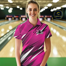 Load image into Gallery viewer, Woman wearing a pink bowling shirt with a logo and text on a bowling alley background