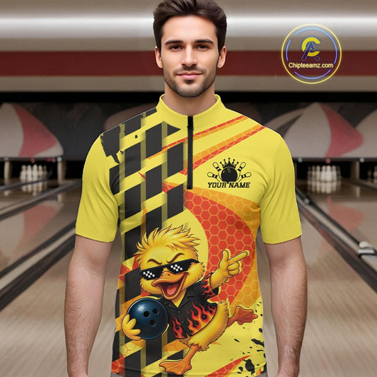 A man modeling a bright yellow short-sleeve cycling jersey with a custom graphic design. The jersey features a black and yellow checkered pattern on one side, a red honeycomb pattern on the other, and a cartoon flamingo bird holding a bowling ball with the text 'YOUR NAME' and a crown.
