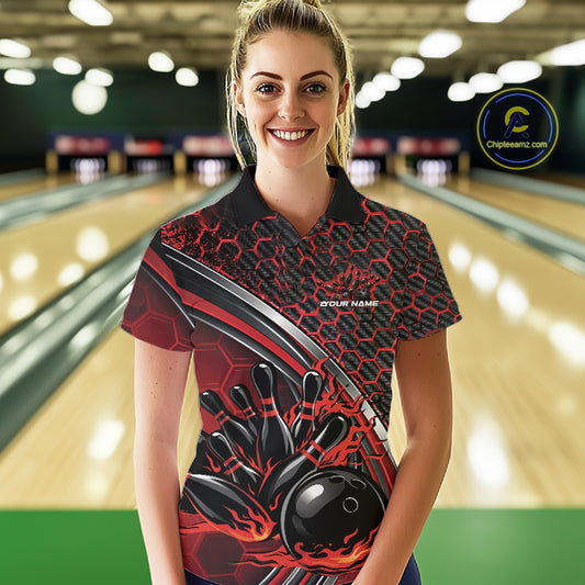 Female model in a bowling lane wearing a black and red polo shirt with honeycomb graphics and a dynamic flame bowling strike illustration.