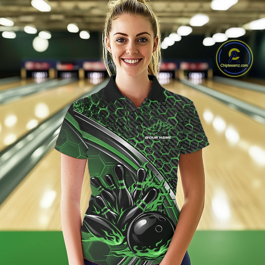 Female model in a bowling lane wearing a black and green polo shirt with honeycomb texture and a flaming bowling strike graphic.