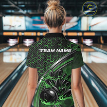Load image into Gallery viewer, Back view of a female model in a bowling venue wearing a black and green polo shirt, showcasing honeycomb pattern and flame bowling ball hitting pins design.