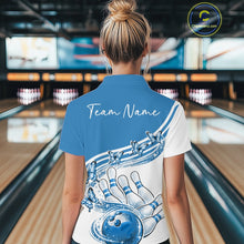 Load image into Gallery viewer, Female model wearing a white and blue bowling quarter zip with butterfly graphics and bowling artwork, back view inside a bowling alley