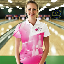 Load image into Gallery viewer, Front view female model at the bowling lane wearing a white and pink bowling polo shirt with bowling ball and pins geometric artwork.
