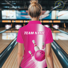 Load image into Gallery viewer, Back view female model in a bowling lane wearing a polo shirt with bowling ball and pins flowing through a pink gradient layout.