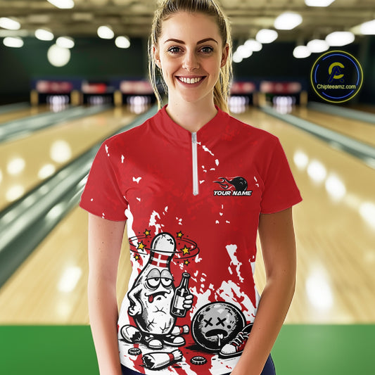 Front view female model in red and white quarter zip bowling shirt in bowling lane, cartoon beer drinking bowling pin graphic design