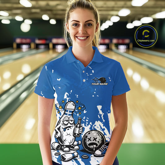 Female model in a bowling lane wearing a blue and white polo shirt, playful drunk bowling pin artwork with beer bottle and bowling ball.