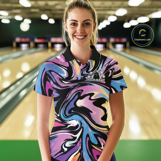 Woman wearing a colorful bowling shirt with a personalized name on a bowling alley.