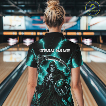 A woman viewed from behind wearing a black short-sleeve bowling shirt with a grim reaper graphic, lightning effects, and the text 'TEAM NAME' on the back, standing in a bowling alley.