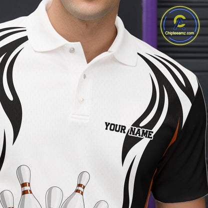 Close-up left chest detail of a white, black, and orange bowling polo shirt with bowling ball and pins graphics.
