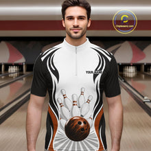 Load image into Gallery viewer, Front view of a male model wearing a white, black, and orange bowling quarter-zip shirt featuring bowling ball hitting the pins artwork inside a bowling center.