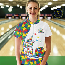 Load image into Gallery viewer, Female model in a bowling lane wearing a white quarter-zip shirt, vibrant autism puzzle bowling artwork with energetic strike-style visuals.