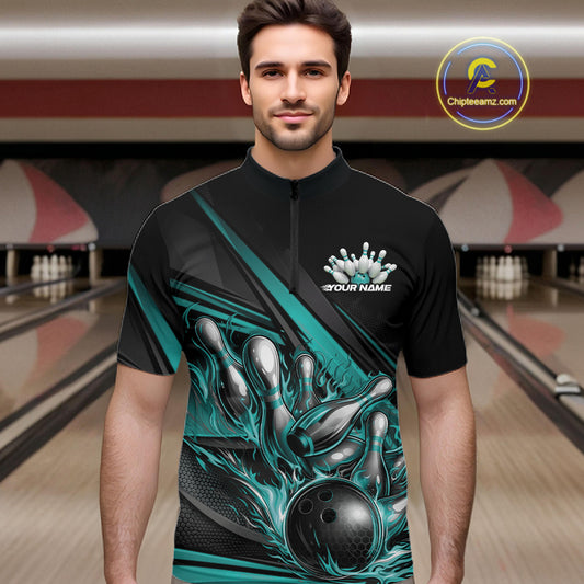 Male model in a bowling lane wearing a black quarter-zip shirt, turquoise flame bowling ball striking pins with modern geometric stripe design.