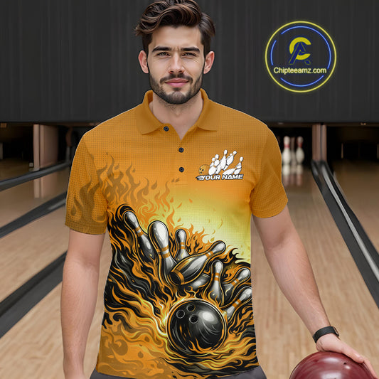 Male model in a bowling lane wearing a yellow polo shirt, front view featuring flame bowling ball knocking down pins artwork