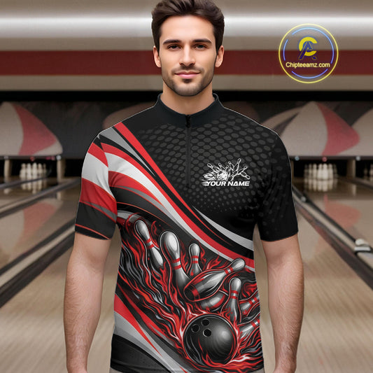 Male model at a bowling lane wearing a black and red quarter-zip shirt, fiery bowling ball striking pins with intense sports design.