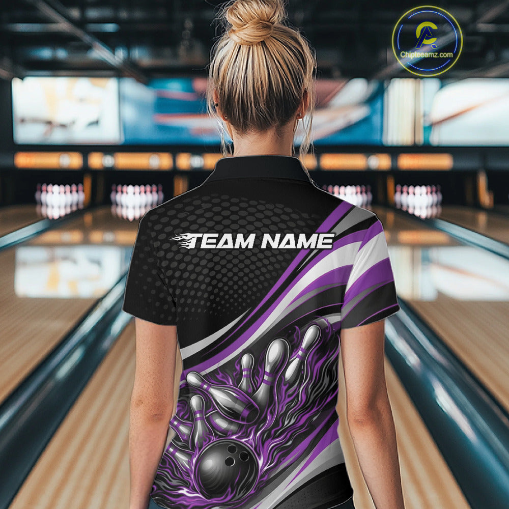 Back view female model in black and purple quarter zip bowling shirt in bowling lane, flame bowling ball and pins athletic graphic