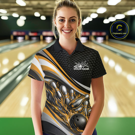 Female model in a bowling lane wearing a black and yellow polo shirt, fiery bowling ball hitting pins with energetic flame graphics.