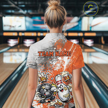 Load image into Gallery viewer, Back view of a female model in a bowling lane wearing an orange and white grunge splatter polo shirt featuring humorous bowling ball and pin battle artwork.