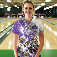 Load image into Gallery viewer, Front view of a female model in a bowling lane wearing a purple and white grunge splatter polo shirt with humorous bowling ball and pin fighting artwork.