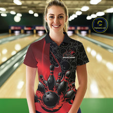 Load image into Gallery viewer, Front view of a female model in a bowling lane wearing a black and red polo shirt with flaming black bowling ball striking pins and bold athletic visuals.