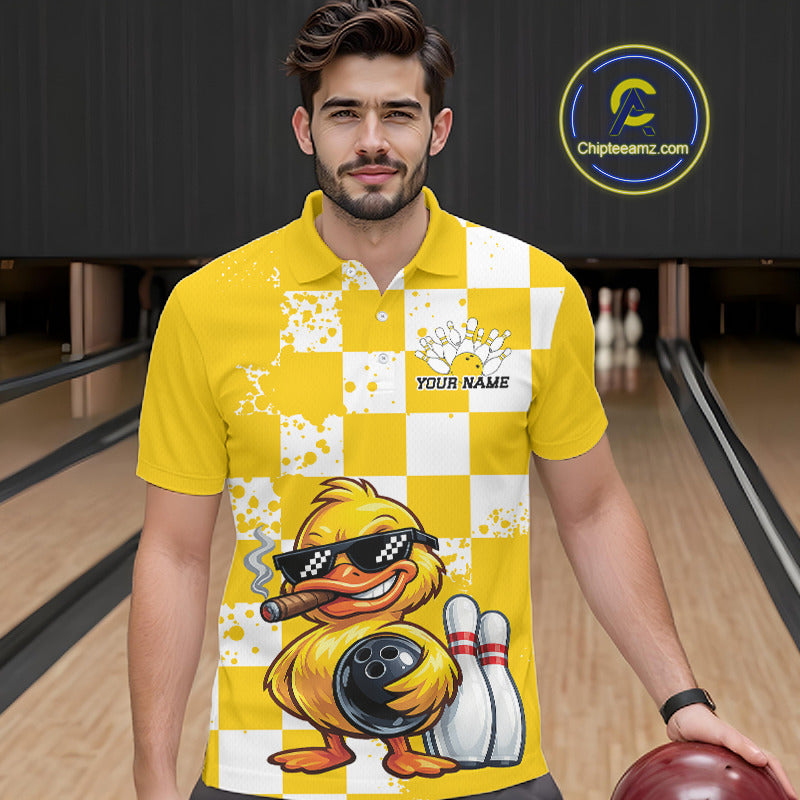A man wearing a yellow and white checkered bowling-themed polo shirt with a cartoon duck graphic, standing in a bowling alley holding a bowling ball. A circular 'Chipleamz.