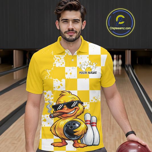 A man wearing a yellow and white checkered bowling-themed polo shirt with a cartoon duck graphic, standing in a bowling alley holding a bowling ball. A circular 'Chipleamz.