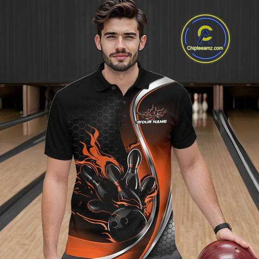 Male model seen from the front in a bowling lane wearing a black and orange polo shirt featuring a flame bowling ball and pins design in a dynamic action scene.