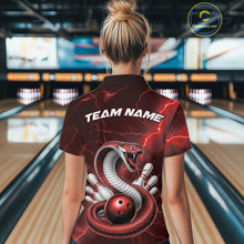 Load image into Gallery viewer, Back view of a womens bowling polo displaying a red cobra wrapped around a bowling ball with scattered pins.