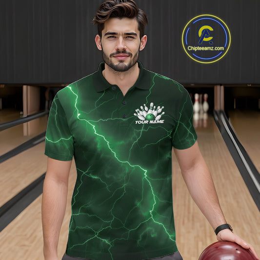 Male model wearing a bowling polo in a bowling lane with green cobra artwork wrapped around a bowling ball and scattered pins.