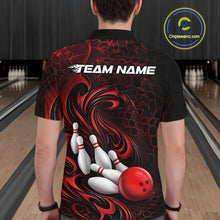 Load image into Gallery viewer, Back view of a male model wearing a black and red bowling polo shirt in a bowling alley featuring a tribal flame bowling ball and pins graphic