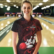 Load image into Gallery viewer, Female model wearing a black and red bowling polo shirt in a bowling alley featuring a tribal flame bowling ball and pins graphic