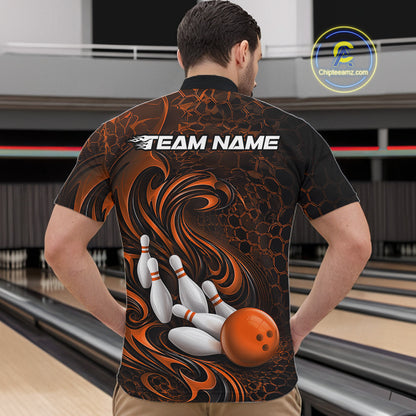Male model wearing a black and orange bowling quarter-zip shirt in a bowling alley featuring a tribal flame bowling ball and pins graphic